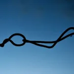 Tie a fishing knot one-handed underwater.