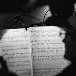 Generate a musical composition that evokes a specific emotional response in the listener based on their brain activity.