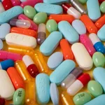 replace 50% of all drug discovery research by autonomously designing and testing new molecules in silico using generative AI and quantum computing simulations