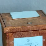 predict the outcome of a country’s national election based on social media sentiment and economic indicators