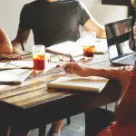 negotiate a corporate merger between two Fortune 500 companies in real time using email and video calls?