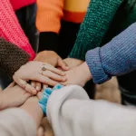 lead a group therapy session with emotional support for participants